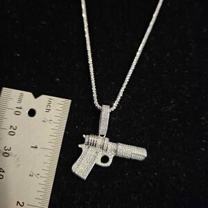 1.68CTW VVSD Moissanite Machine gun pendant on 18" chain in .925 Sterling Silver